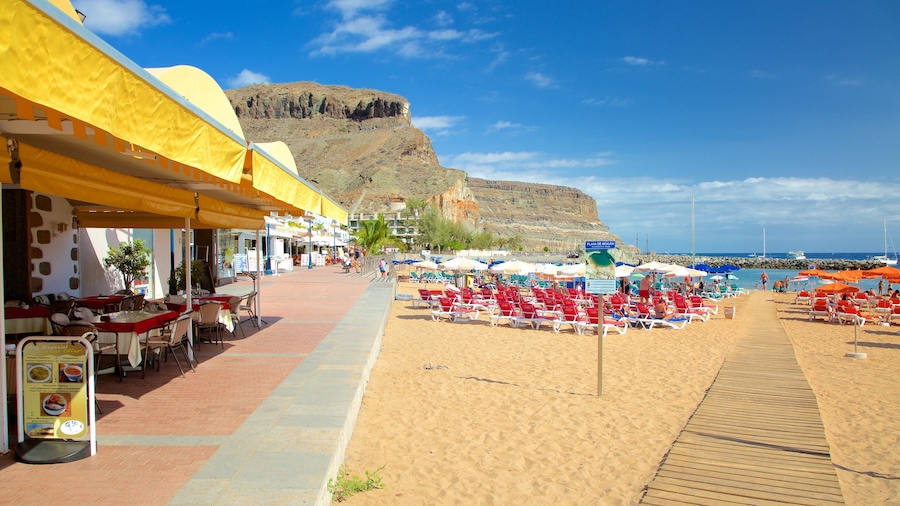 Playa de Mogan showing a gorge or canyon, a beach and general coastal views