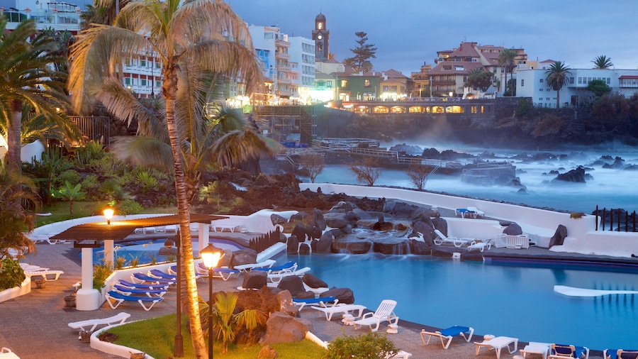 Puerto de la Cruz featuring a luxury hotel or resort, a pool and a coastal town