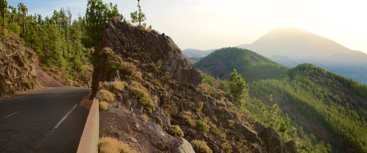 Santiago del Teide which includes a sunset, forest scenes and mountains