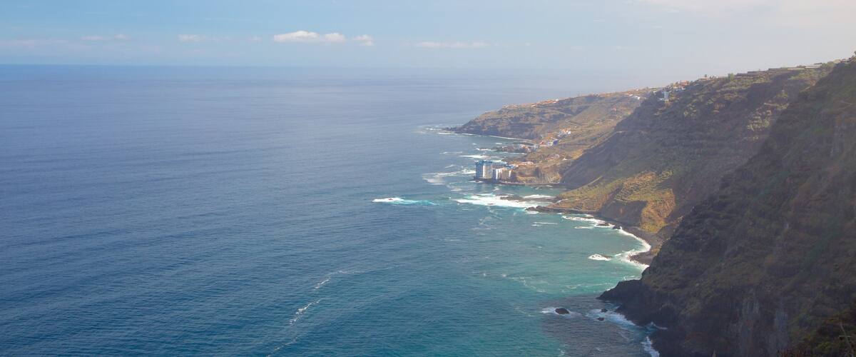 Sauzal featuring mountains, rocky coastline and general coastal views