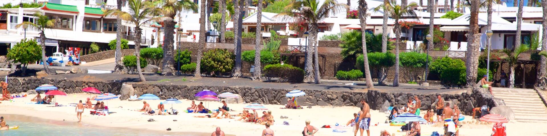 Playa Blanca welches beinhaltet allgemeine Küstenansicht, Küstenort und Strand
