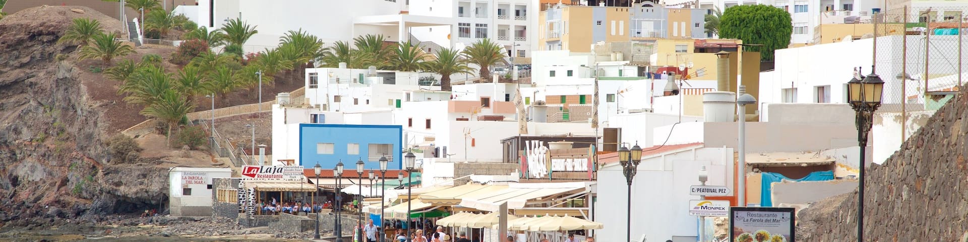 Morro Jable showing a coastal town and a beach