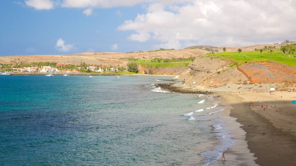 Meloneras-strand inclusief algemene kustgezichten en een zandstrand