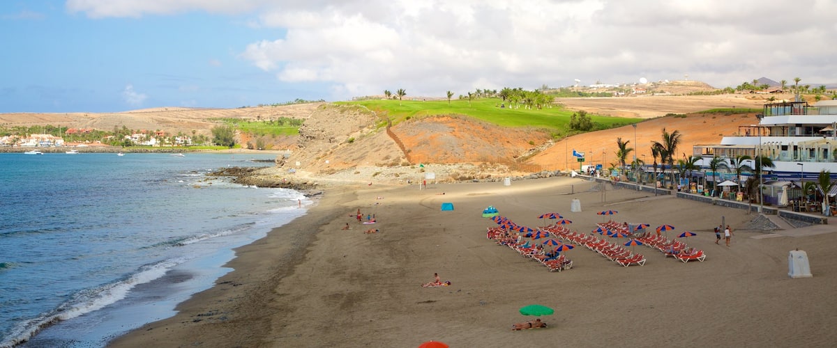 Plage des Meloneras montrant plage de sable et vues littorales