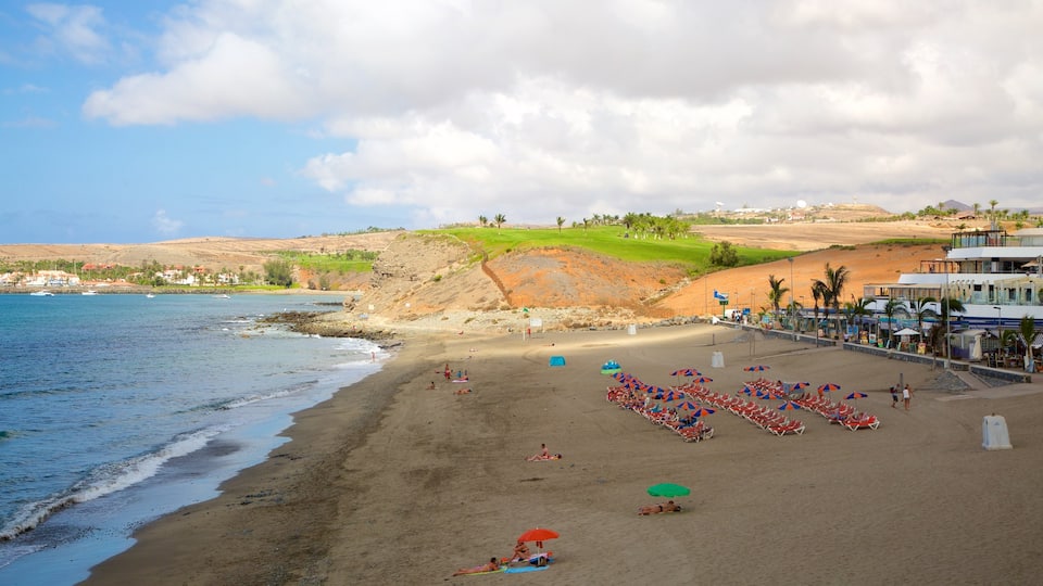 Meloneras Beach which includes a sandy beach and general coastal views