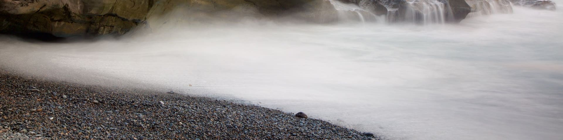 Ajuy Beach showing mist or fog, general coastal views and rocky coastline