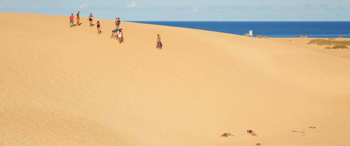 La Oliva which includes a sandy beach as well as a small group of people