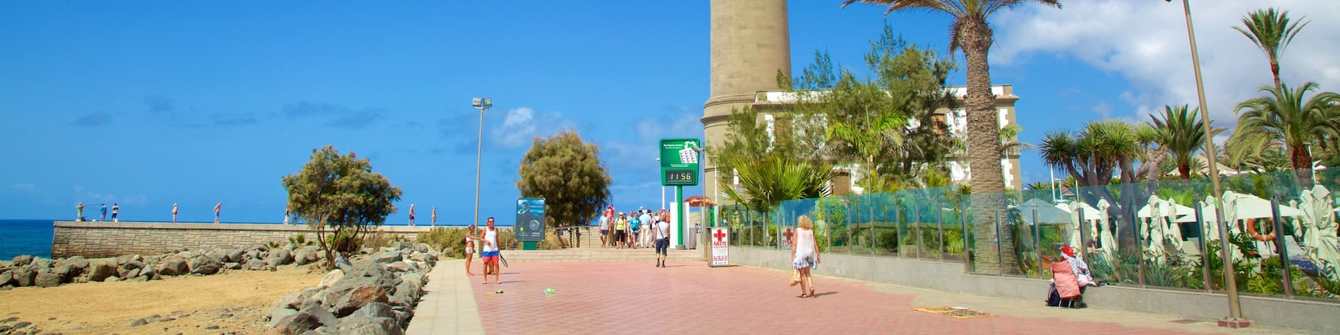 Maspalomas Lighthouse showing general coastal views, a sandy beach and a lighthouse