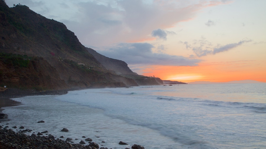 El Socorro Beach showing waves, general coastal views and a pebble beach