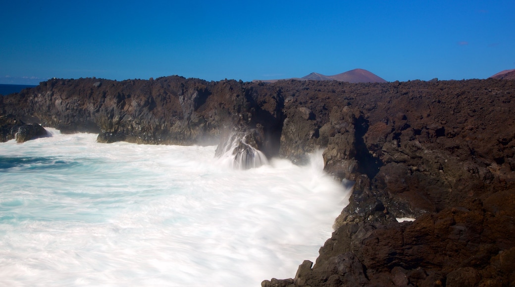 Los Hervideros Caves showing waves and rugged coastline