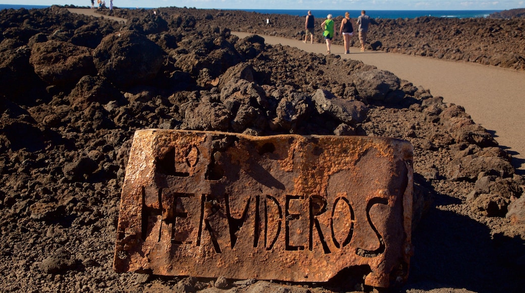 Los Hervideros Caves showing signage