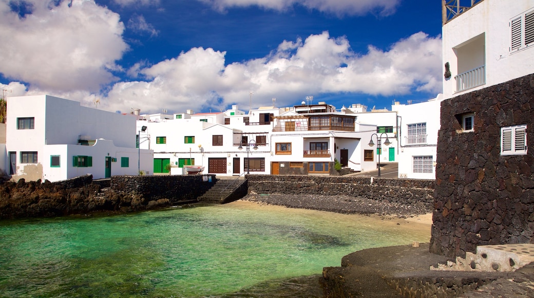 Lanzarote featuring rocky coastline, a coastal town and general coastal views