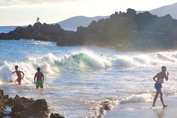 Puerto del Carmen featuring a sandy beach, general coastal views and swimming