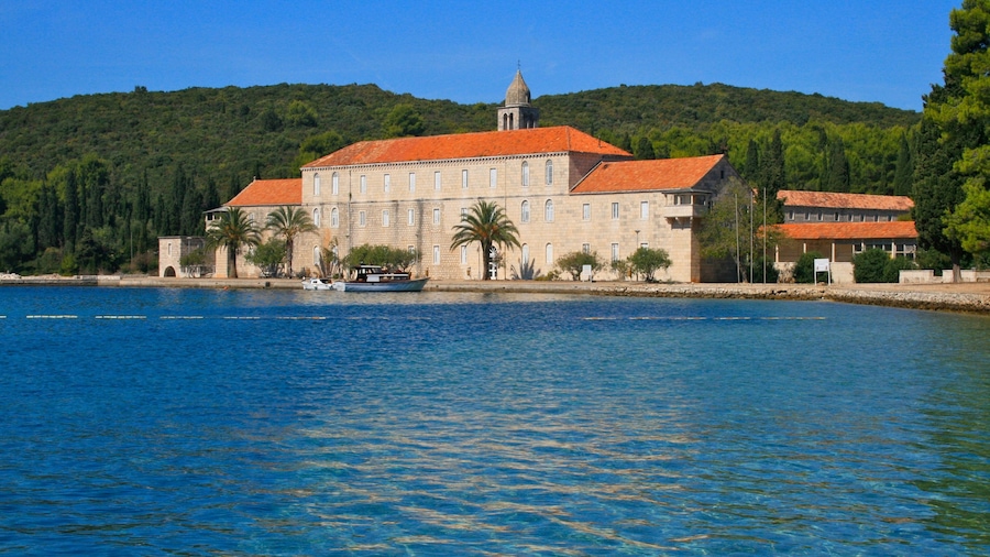 Croatia showing a lake or waterhole, a house and boating