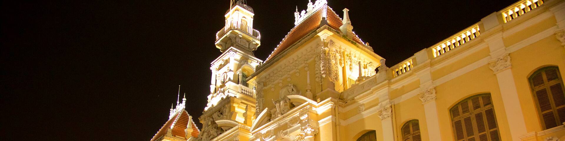 Ho Chi Minh City Hall which includes night scenes and heritage architecture