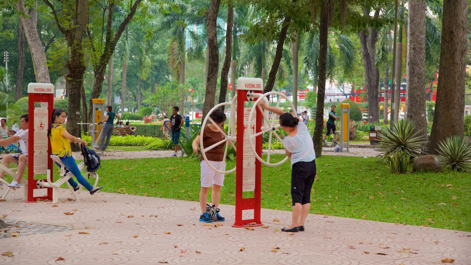 Tao Dan Park featuring a park as well as a small group of people