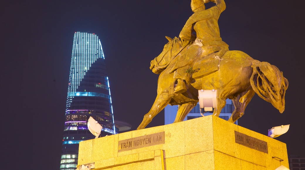 Saigon Skydeck which includes night scenes, a skyscraper and a statue or sculpture