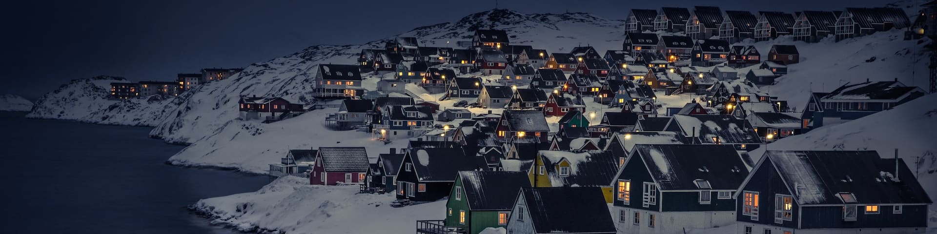 Nuuk featuring mountains, night scenes and snow