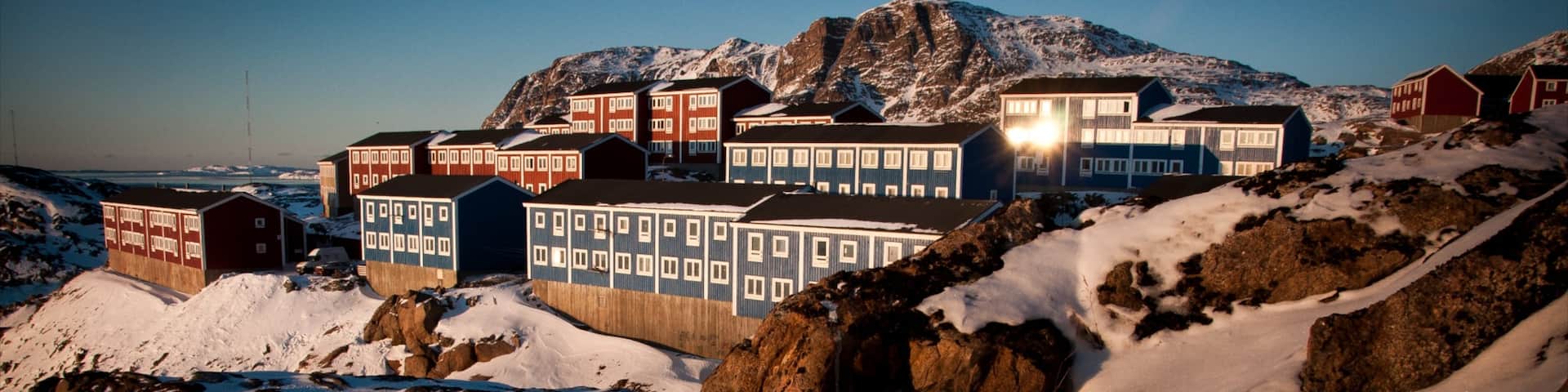 Sisimiut showing a sunset, snow and a small town or village