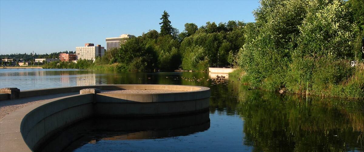 Olympia showing a pond and a garden