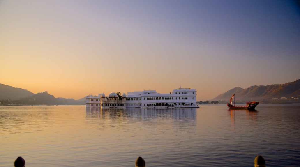 Lake Palace showing a lake or waterhole, boating and a sunset