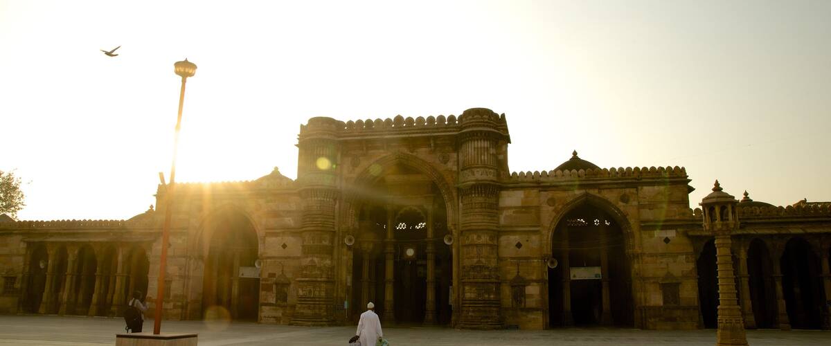 Jama Masjid Mosque which includes heritage architecture and a sunset