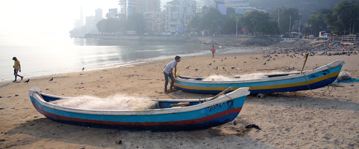 Mumbai which includes general coastal views, boating and a sandy beach