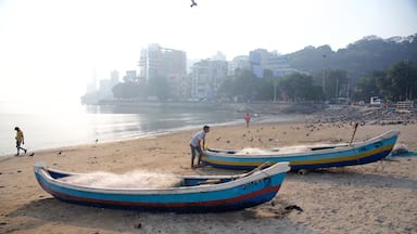 Mumbai showing boating, a beach and general coastal views