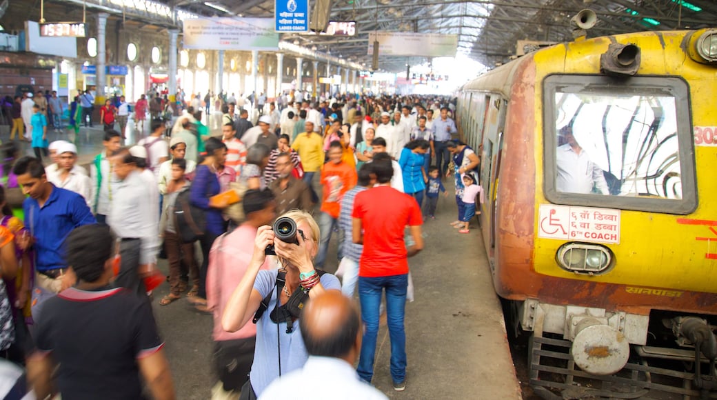 Chhatrapati Shivaji Terminus featuring railway items as well as a large group of people