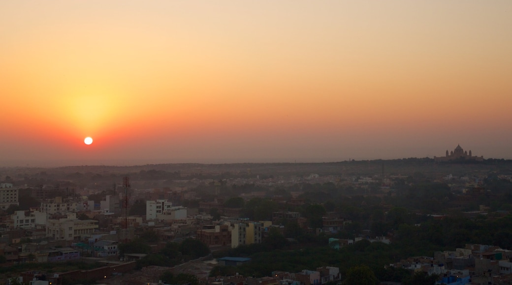 Umaid Bhawan Palace which includes a city and a sunset