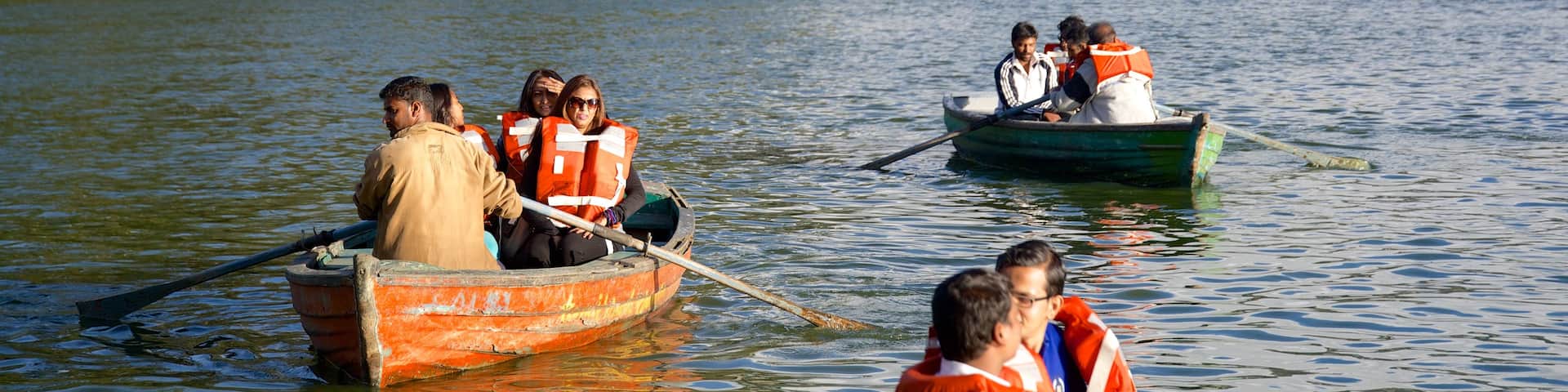 Ooty Lake which includes a lake or waterhole and kayaking or canoeing as well as a small group of people