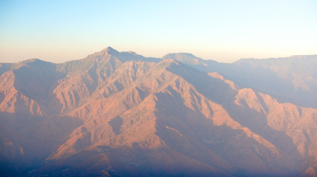 Gun Hill showing a sunset and mountains