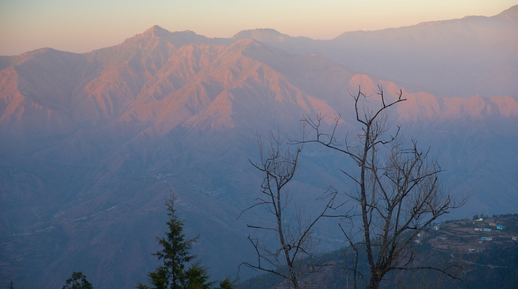 Gun Hill which includes a sunset and mountains