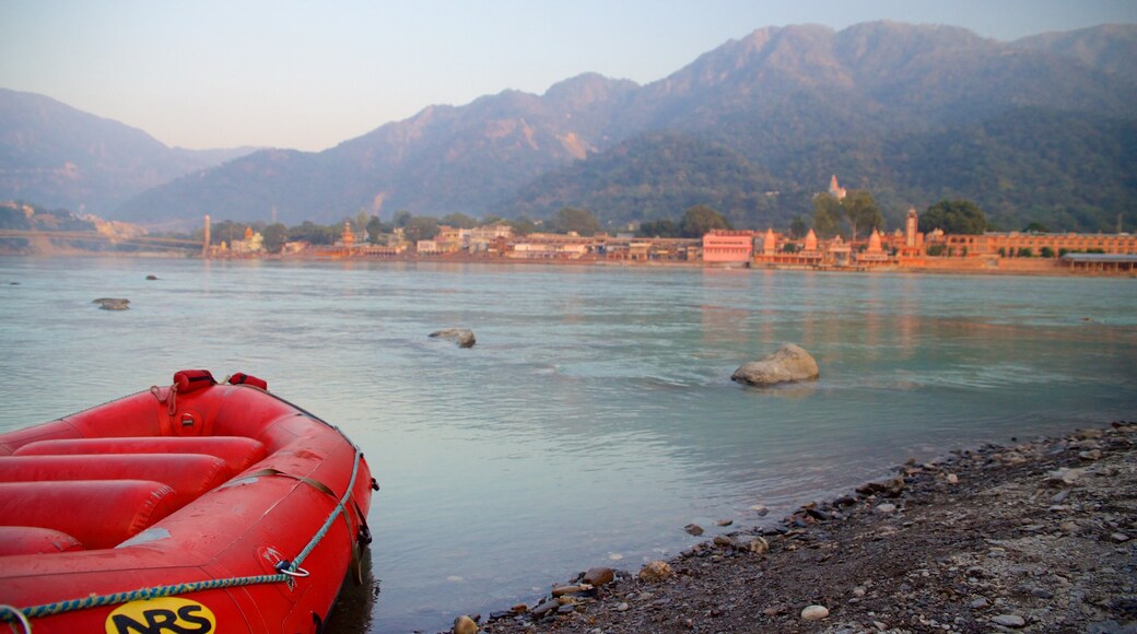 Parmarth Niketan featuring a river or creek, kayaking or canoeing and a small town or village