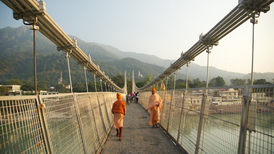 Ram Jhula which includes a small town or village and a suspension bridge or treetop walkway as well as a small group of people
