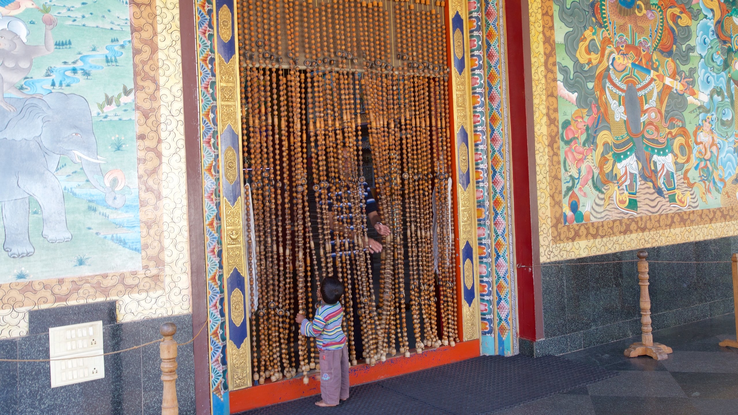 Golden Temple showing a temple or place of worship as well as an individual child
