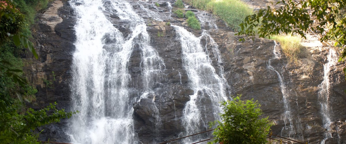 Madikeri featuring a waterfall