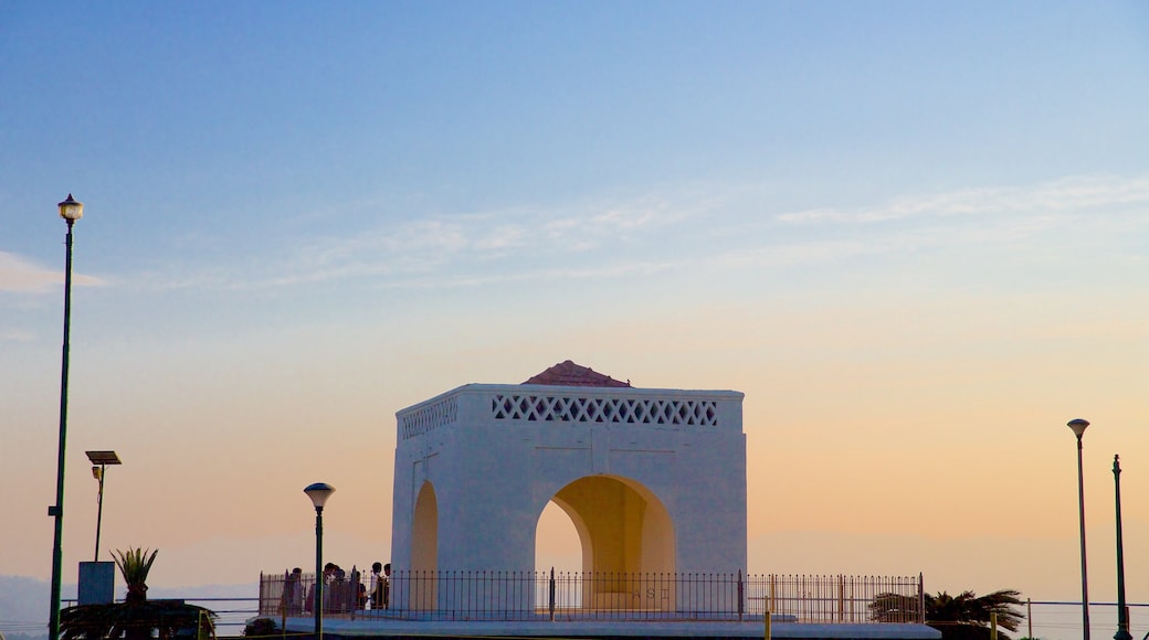 Raja\'s Seat which includes a sunset and a monument