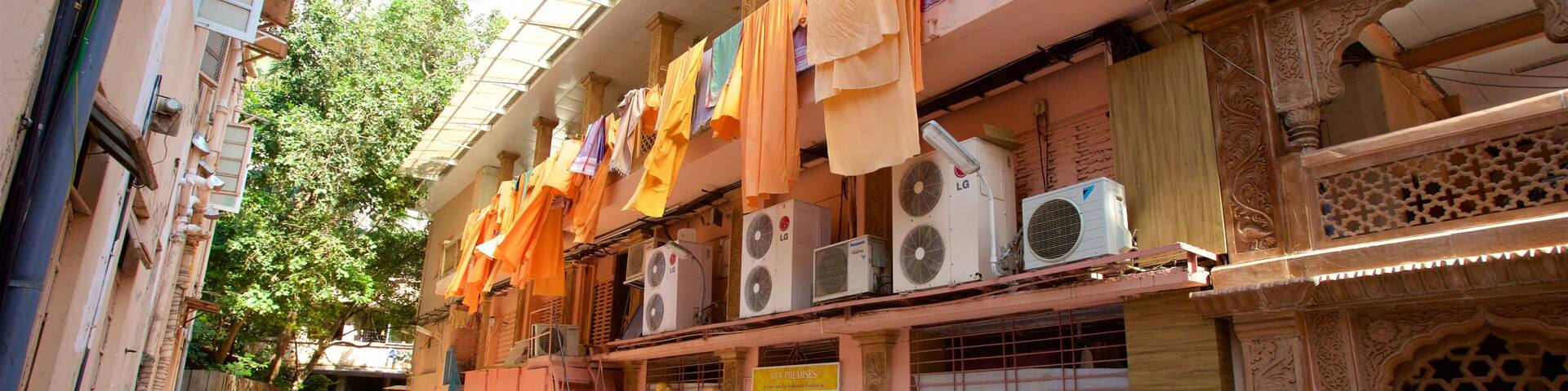 ISKCON Temple featuring street scenes as well as a small group of people
