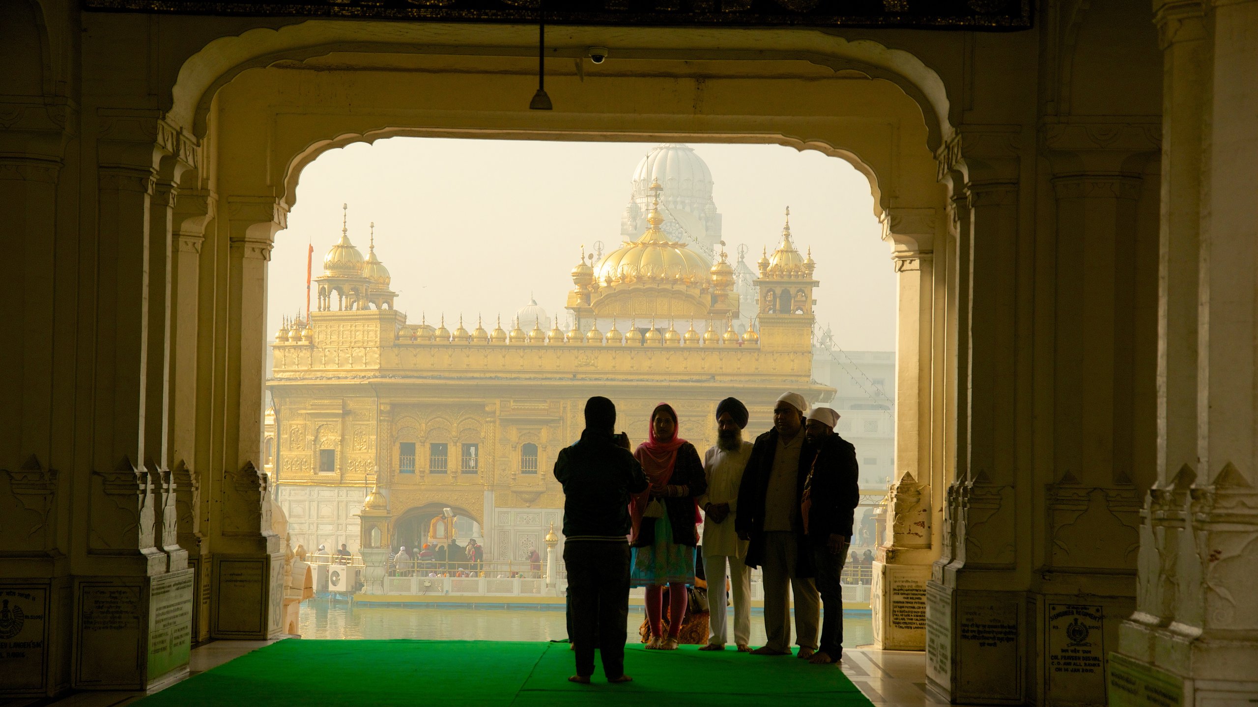 Golden Temple which includes a temple or place of worship and heritage elements as well as a small group of people