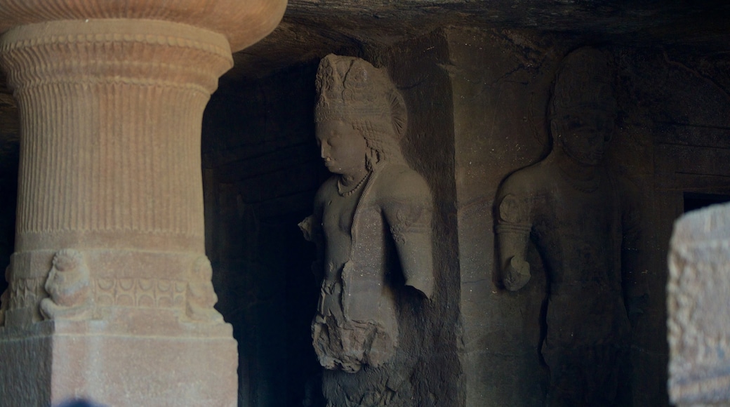 Elephanta Caves featuring caves, heritage elements and a statue or sculpture