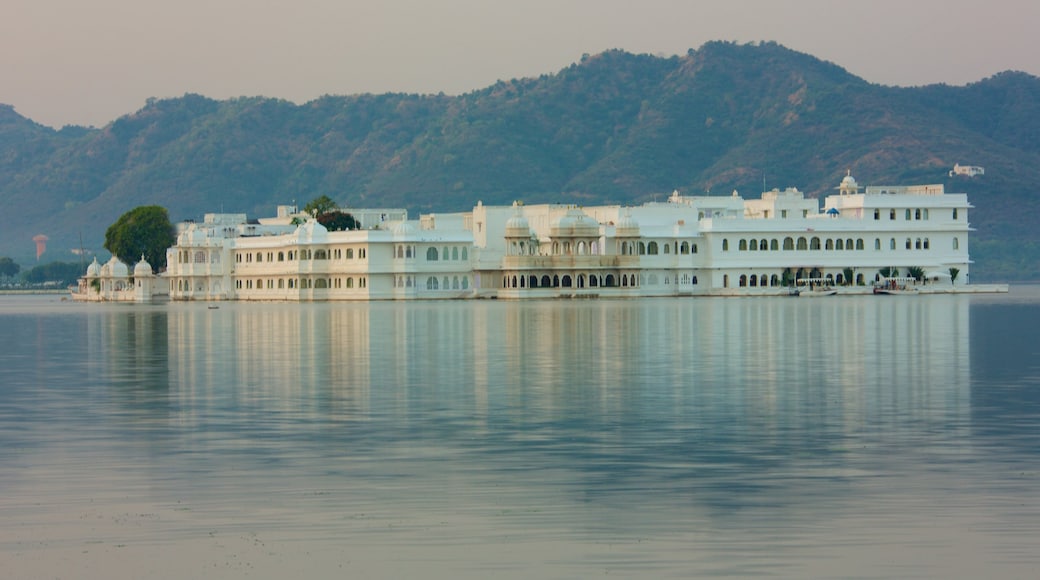 Lake Palace which includes island views, a lake or waterhole and a sunset