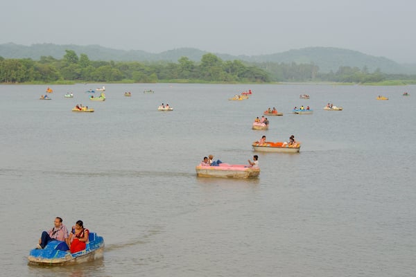 Sukhna Lake which includes a lake or waterhole and kayaking or canoeing as well as a small group of people
