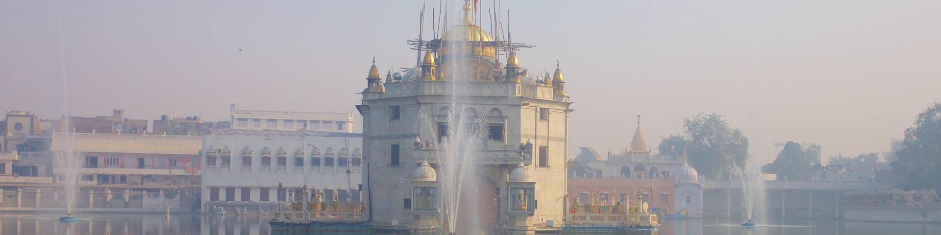 Durgiana Temple which includes a temple or place of worship, heritage elements and a lake or waterhole