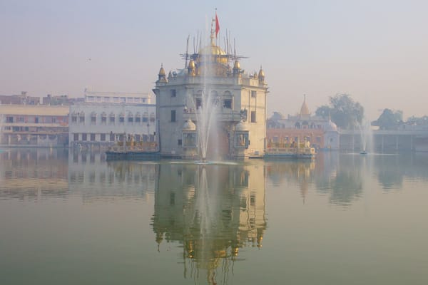 Durgiana Temple showing a temple or place of worship, heritage elements and a lake or waterhole