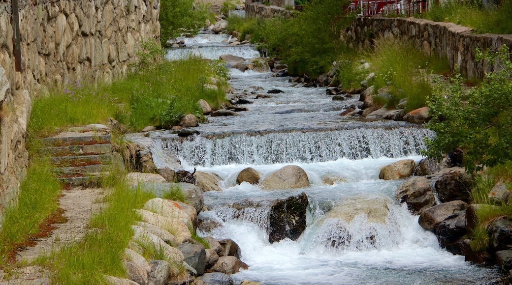 Arinsal which includes a waterfall and a river or creek