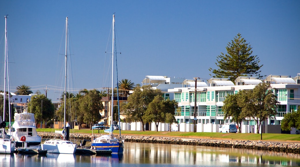 Holdfast Marina which includes a coastal town, a marina and general coastal views