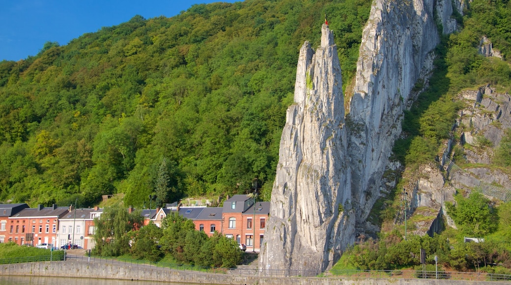 Dinant showing a lake or waterhole, a small town or village and mountains