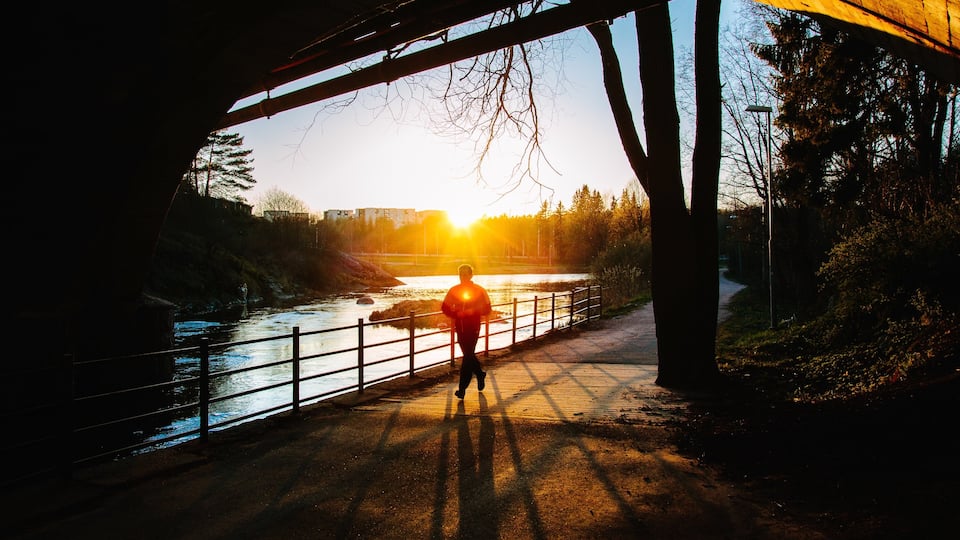 Vantaa showing a lake or waterhole, a sunset and hiking or walking