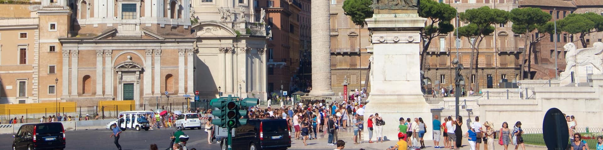 Piazza Venezia which includes a fountain, heritage architecture and a square or plaza